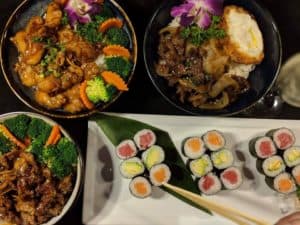 Assorted Thai dishes including stir-fry, curry, and sushi at Thai Lotus Restaurant.