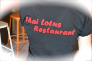 Thai Lotus Restaurant logo on black shirt, showcasing authentic Thai cuisine.